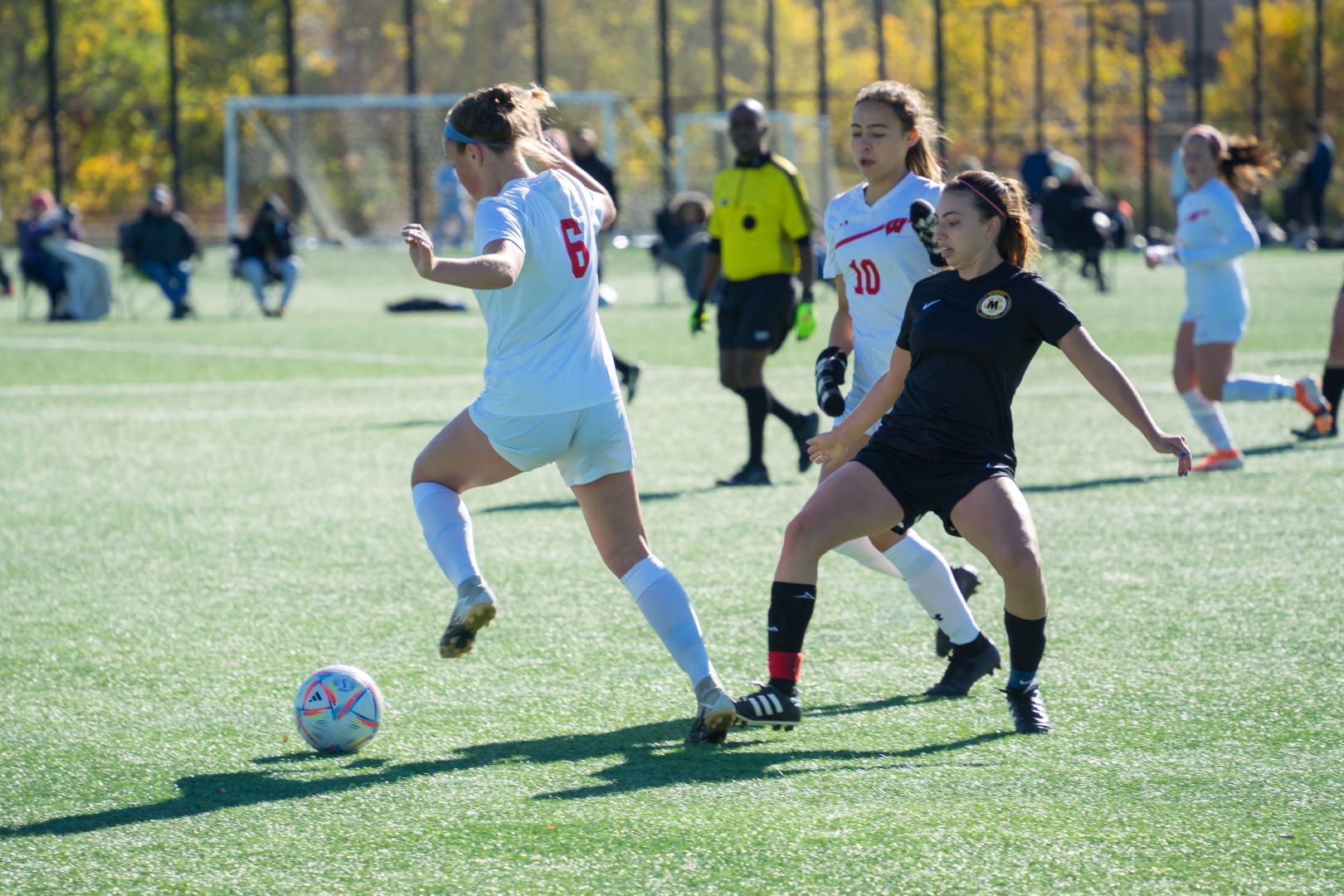 soccer player makes a touch around opponent